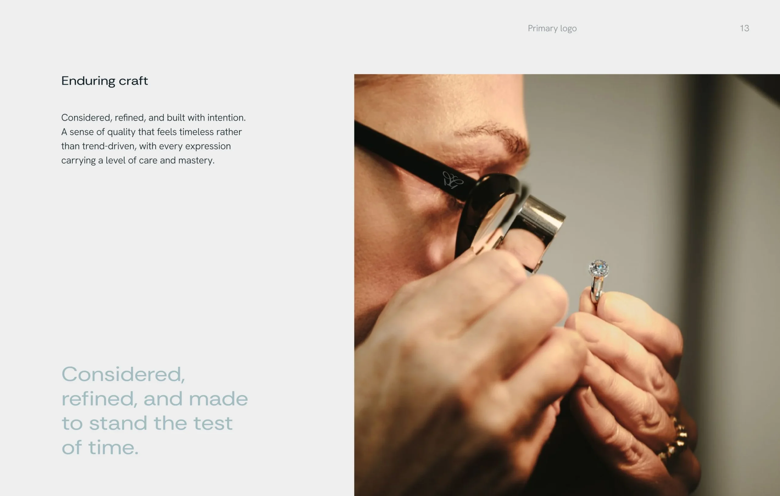 Close-up of a craftsperson using a magnifying loupe and tools to inspect a small jewelry piece, conveying precision, care, and enduring craftsmanship.