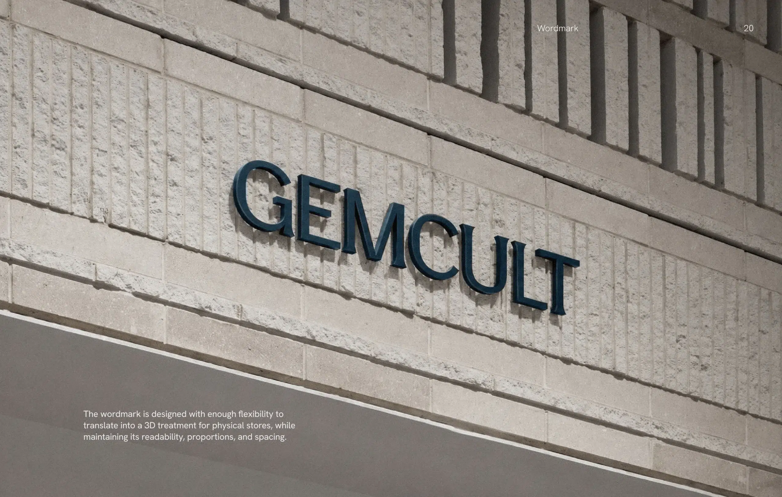 Alt text: “Close-up of a textured concrete building facade with bold blue GEMCULT lettering, conveying a modern, minimalist architectural tone.”