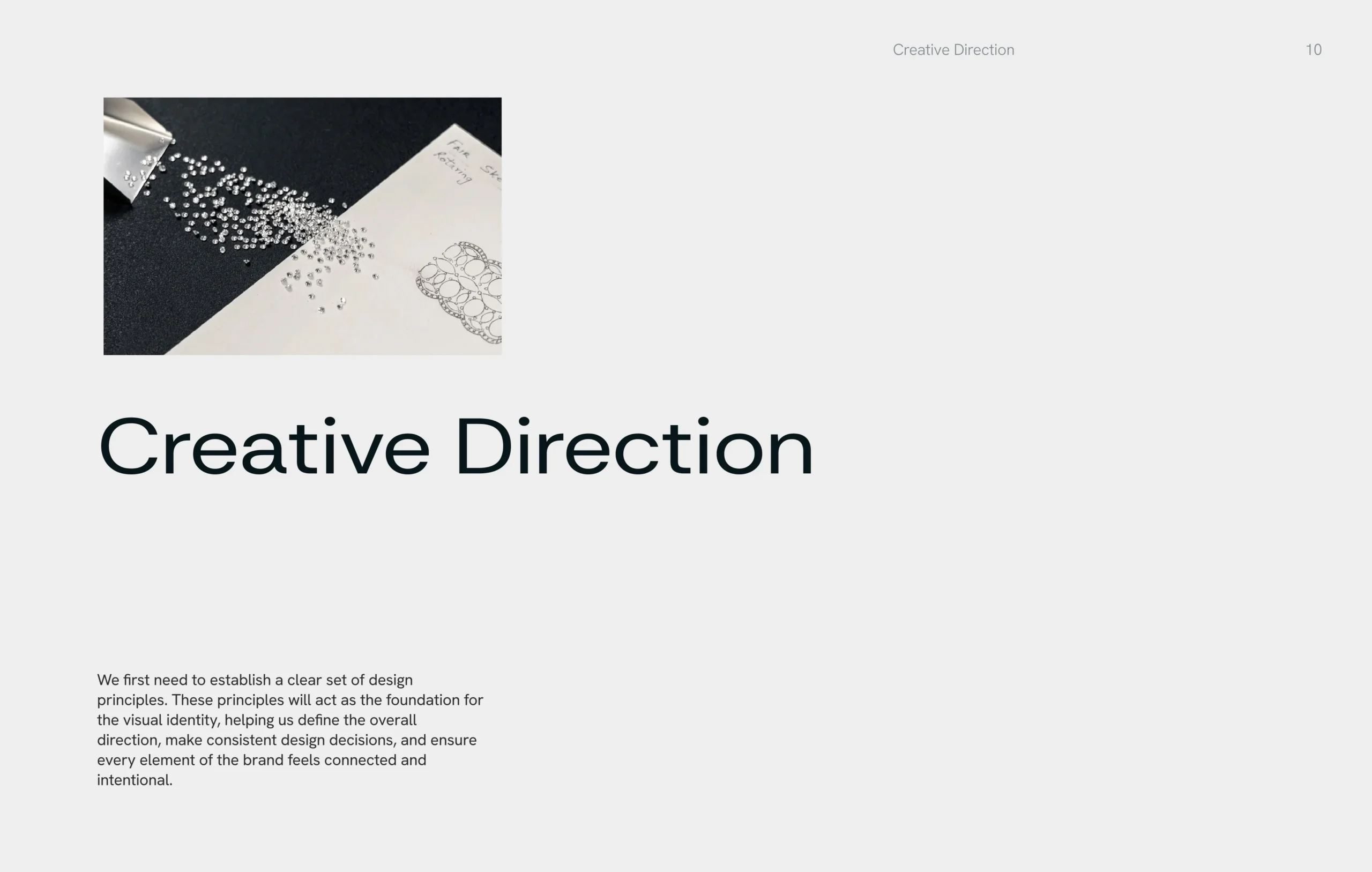 Minimalist “Creative Direction” presentation slide with abstract black-and-white particle artwork, small explanatory text, and a refined editorial tone.